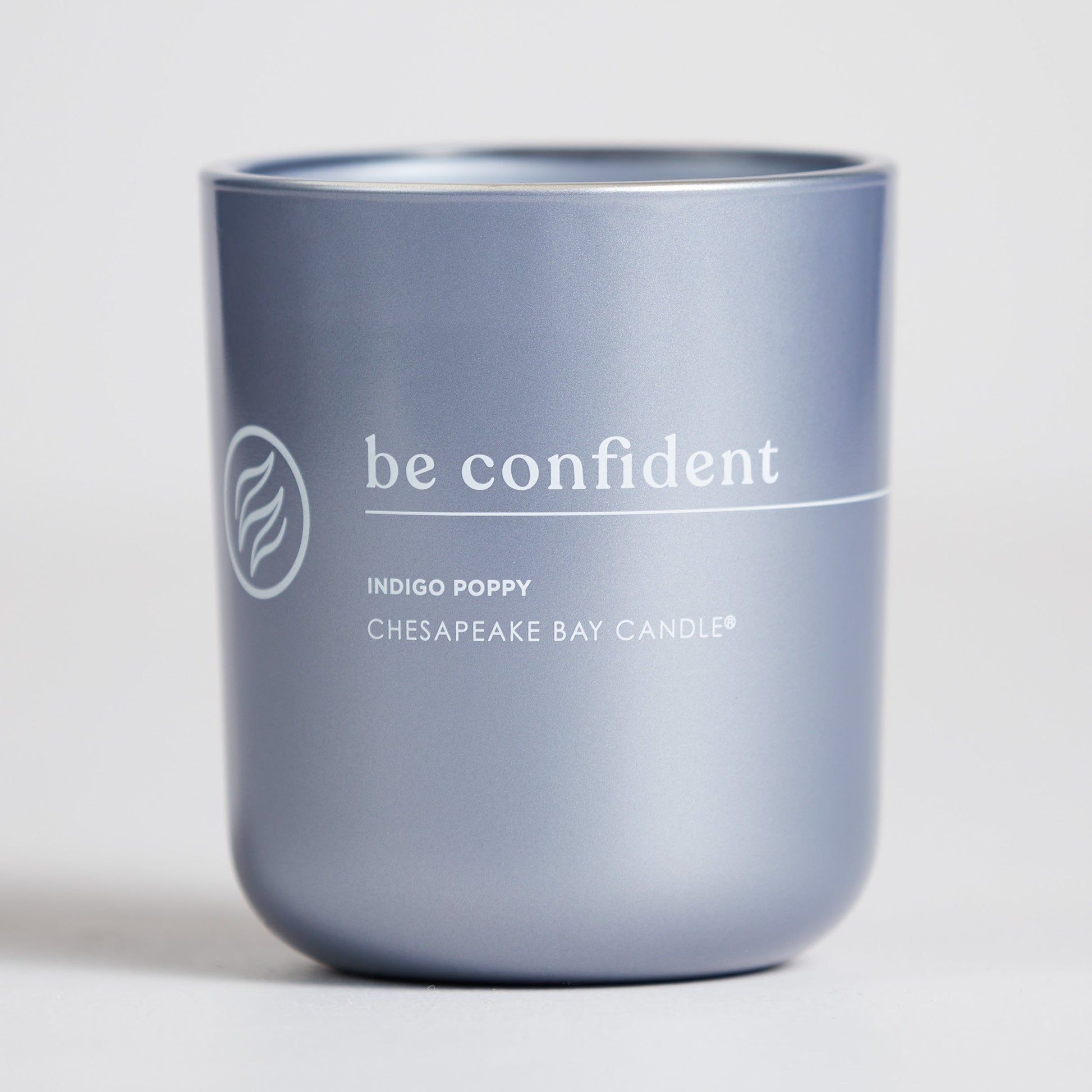 chesapeake bay candle intentions collection be confident indigo poppy medium two wick candle in a white backdrop